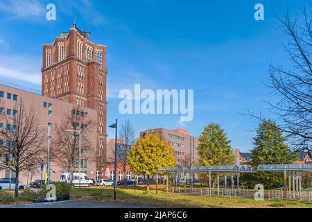 Berlin, Germany - October 30, 2021: Company grounds of the Borsigwerke in Berlin-Tegel with the Streetl Am Borsigturm and a high-rise steel frame Bric Stock Photo