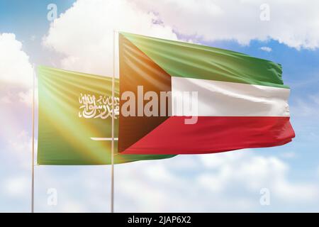 Kuwait and Saudi Arabia flags waving together in the wind on blue ...