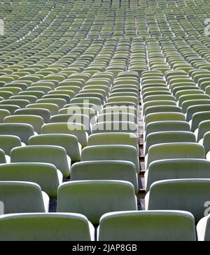 many free places without people on the bleachers in the empty stadium before the event Stock Photo
