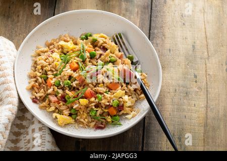 Breakfast fried rice with bacon and scrambled eggs Stock Photo