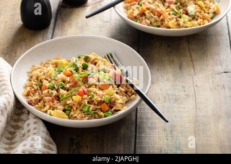 Breakfast fried rice with bacon and scrambled eggs Stock Photo