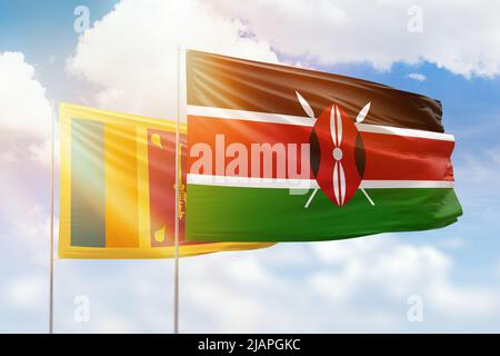 Sunny blue sky and flags of kenya and sri lanka Stock Photo