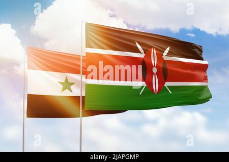 Sunny blue sky and flags of kenya and syria Stock Photo