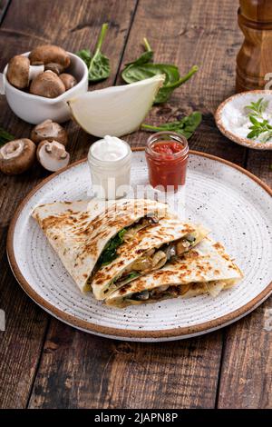 Quesadillas with mushroom, spinach and caramelized onions Stock Photo