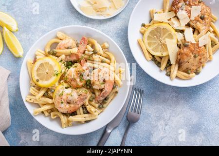 Chicken and shrimp piccatta with penne pasta Stock Photo