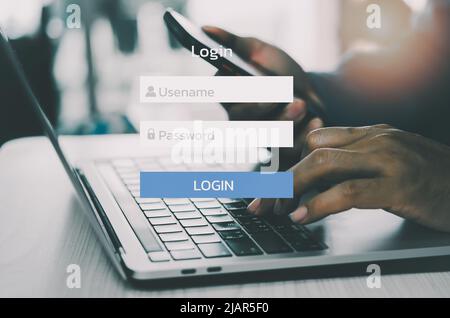 man using laptop computer and sign up or log in username password virtual touch screen. Stock Photo