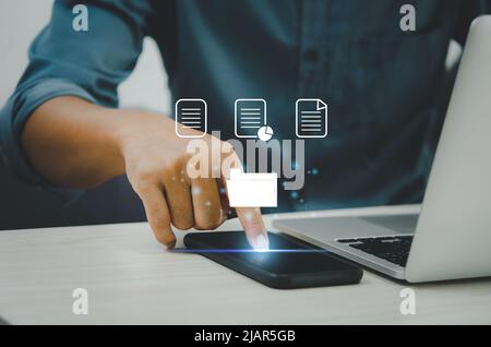 Businessman touching on icons on virtual screen Enterprise Resource Planning ERP document management.Document Management System DMS concept. Stock Photo