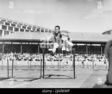 Empire Games - Lavery wins 120 yds men's hurdles ca. 1938 Stock Photo