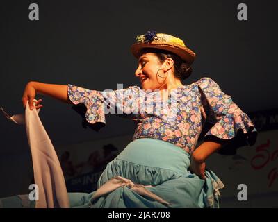 Marisol Ponce Pinedo dancing Zamacueca, an old traditional peruvian flirting dance, performed by the National Group of Folklore, in the main square of Lima, within the framework of the activities for the International Dance Day Stock Photo