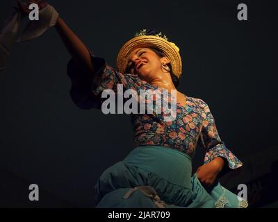 Marisol Ponce Pinedo dancing Zamacueca, an old traditional peruvian flirting dance, performed by the National Group of Folklore, in the main square of Lima, within the framework of the activities for the International Dance Day Stock Photo