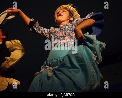 Marisol Ponce Pinedo dancing Zamacueca, an old traditional peruvian flirting dance, performed by the National Group of Folklore, in the main square of Lima, within the framework of the activities for the International Dance Day Stock Photo