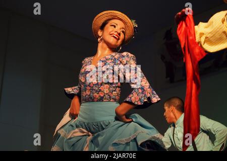 Marisol Ponce Pinedo dancing Zamacueca, an old traditional peruvian flirting dance, performed by the National Group of Folklore, in the main square of Lima, within the framework of the activities for the International Dance Day Stock Photo