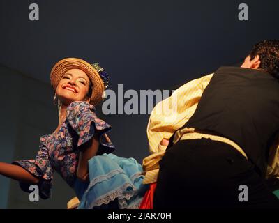 Marisol Ponce Pinedo dancing Zamacueca, an old traditional peruvian flirting dance, performed by the National Group of Folklore, in the main square of Lima, within the framework of the activities for the International Dance Day Stock Photo