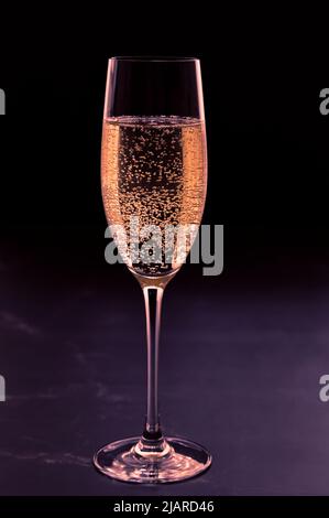 Glass of champagne on dark background Stock Photo