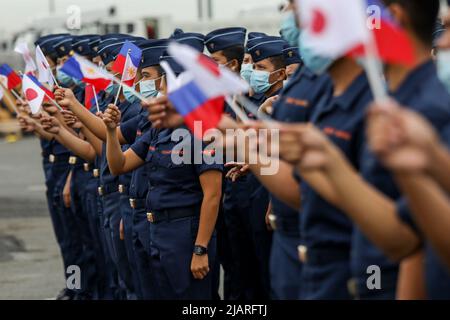 Manila, Philippines. 1st June, 2022. Members of the Philippine Coast Guard wave as they welcome the arrival of the BRP Melchora Aquino at Manila's port area, Philippines. June 1, 2022. The brand new multi-role vessel built by Japan was ordered by the coast guard to strengthen its maritime security, safety and marine environmental protection capabilities in the country's waters, especially in the disputed South China Sea where the Philippines continues to have tense territorial standoffs with China. (Credit Image: © Basilio Sepe/ZUMA Press Wire) Stock Photo