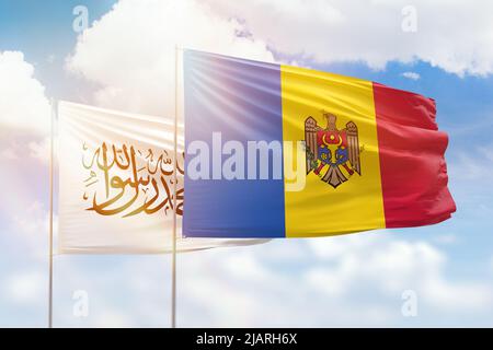 Sunny blue sky and flags of moldova and afghanistan Stock Photo