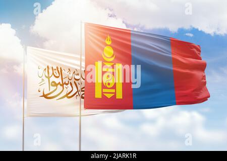 Sunny blue sky and flags of mongolia and afghanistan Stock Photo