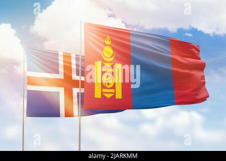 Sunny blue sky and flags of mongolia and iceland Stock Photo