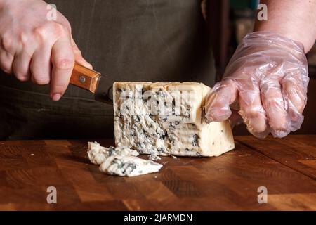 Cheese shop. Roquefort. Selective focus. Close up. Stock Photo