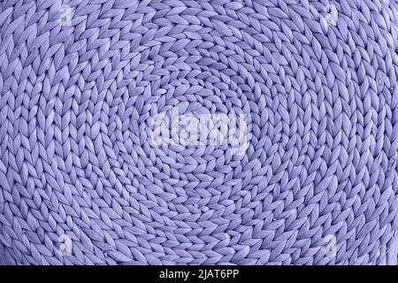 close-up of violet rattan texture. Background with round large straw fabric. textured water hyacinth background. very peri Stock Photo