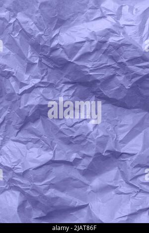 Textured paper background. Recycled paper, crumpled paper. Violet toned. Very peri Stock Photo