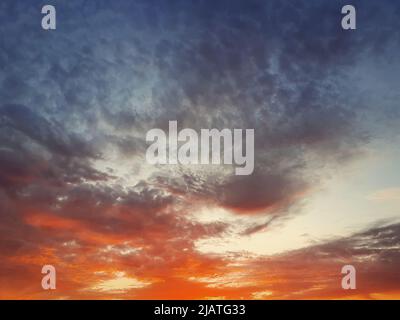 Beautiful sunset cloudscape scene. Abstract clouds texture, celestial beauty. Nebula dusk view Stock Photo