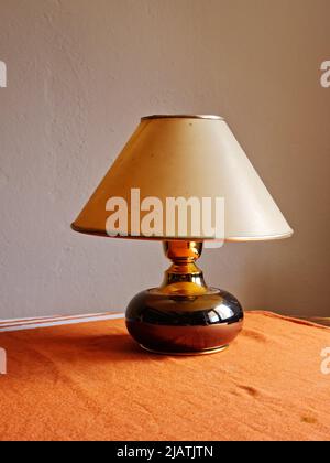 Old lamp on a table Stock Photo