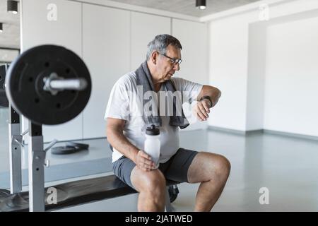 Active and healthy senior exercising in a gym Stock Photo