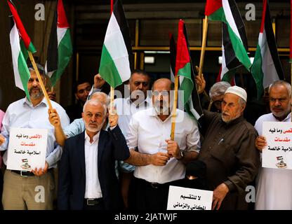 May 29, 2022, Gaza City, Gaza Strip, Palestine: Gaza, Palestine, 29 May 2022. Palestinians wave their national flag in Gaza City to protest against the Israeli Flag March through Jerusalem Old City on Sunday. The Flag March is an annual event marking Israel's capture of East Jerusalem in 1967, with right-wing Israeli nationalists singing and dancing during the rally and insulting Palestinians. The already high tension in the region was increased by the storming by Israeli ultra-nationalists and Israeli settlers of the Al-Aqsa Mosque compound both before and during the march (Credit Image: © Stock Photo