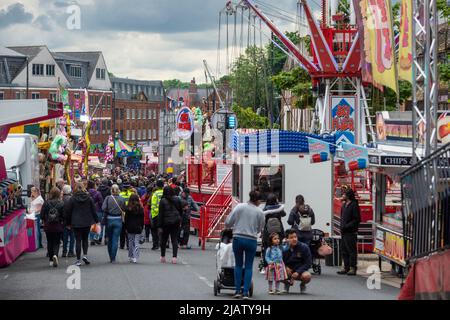 London, UK. 1st June, 2022. People visit Pinner Fair in Pinner, north-west London. The town has had an annual street fair held in late May/early June since 1336, when it was granted by Royal Charter. This year marks the fair's return after being cancelled due to the Covid-19 pandemic. The fair remains popular with schoolchildren and families during the half-term holiday, on the first Wednesday following Whitsunday. Credit: Stephen Chung/Alamy Live News Stock Photo