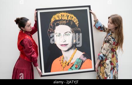 Bonhams, New Bond Street, London, UK. 1st June, 2022. Bonhams Prints & Multiples London sale takes place on 29 June. Based on a photograph taken by Peter Grugeon, released to celebrate Her Majesty's Silver Jubilee in 1977, Andy Warhol's Queen Elizabeth II, 1985, gives The Queen a signature Warhol pop art makeover. Queen Elizabeth II, a unique screenprint in colours by Andy Warhol (1928-1987), leads the London sale. The print, which was part of Warhol's 1985 Reigning Queens series, has an estimate of £120,000 - 180,000. Credit: Malcolm Park/Alamy Live News Stock Photo