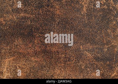 Weathered brown leather surface close up for texture and background Stock Photo