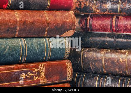 Old obsolete books pile covers close up for texture and background Stock Photo