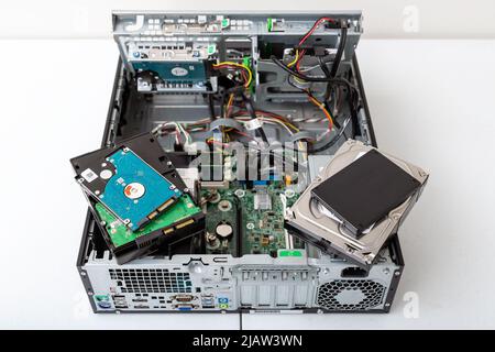 Woodville, Australia - October 15, 2021: Close-up top view of business desktop computer with SSD and spindle hard drives. Stock Photo