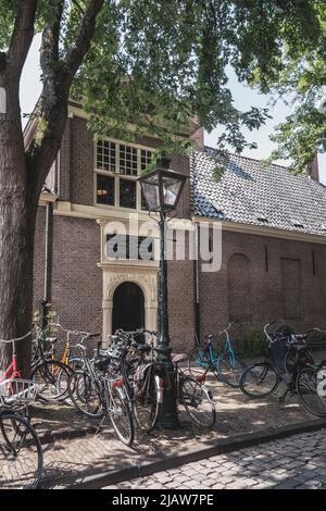 Leiden, Netherlands - July 25, 2021: Bicycles and typical Dutch houses Stock Photo