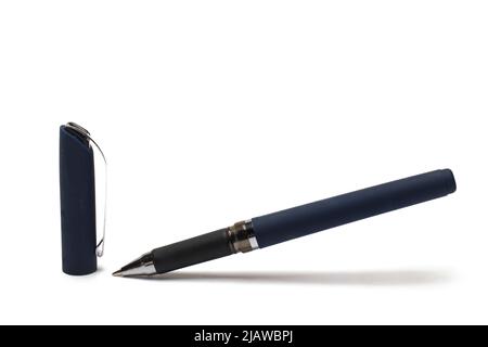 high quality close up of dark blue pen with metal tip next cap with silver clip against white background Stock Photo