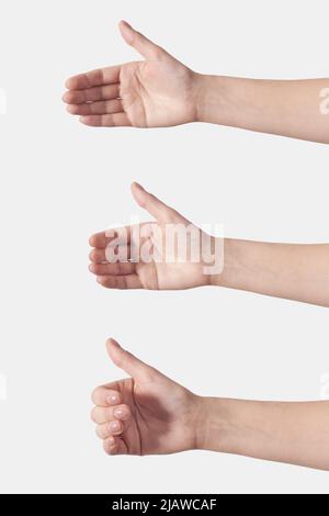 Set of variations female hand holding something like a bottle or can isolated on white background. Soft grab action woman hands. Stock Photo