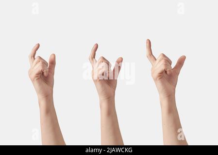 Horizontal female hands making size gesture that measuring, thickness with fingers, isolated on white background. Hand with fingers open steps. Stock Photo