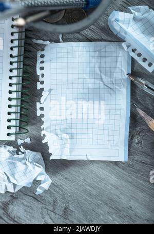 Crumpled pages and notebook Stock Photo