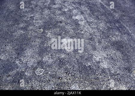 Detail of shoe soles branding on the asphalt Stock Photo