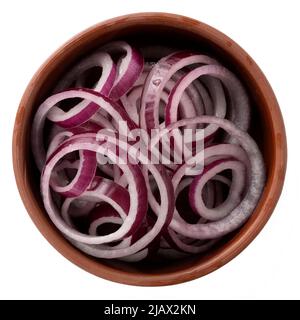 Raw Red onion sliced into rings in a bowl isolated on a white background, top view Stock Photo