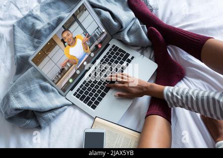 African american businesswoman on video call with female african american colleague working at home Stock Photo