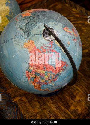 A vintage globe showing North American for sale in an antique shop in Santa Fe, New Mexico. Stock Photo