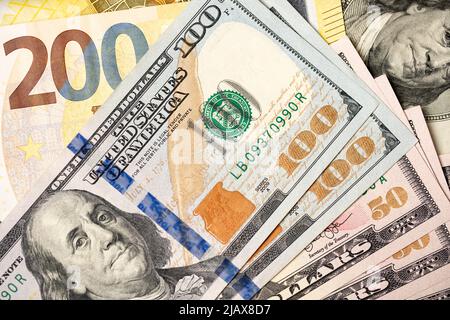 Euro and dollar banknotes, 200 euros next to fifty and 100 dollar bills. Exchange USD and EUR concept Stock Photo