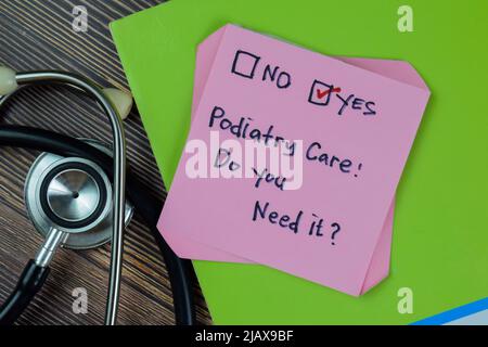 Concept of Podiatry Care, Do you need it? Yes write on sticky notes isolated on Wooden Table. Stock Photo