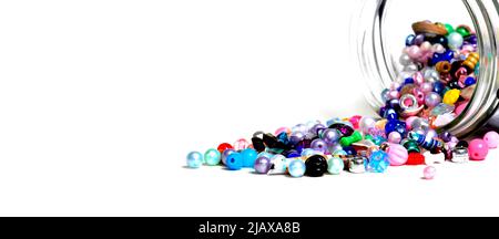 Beads in glass jars for creating art hobbies jewelry on white background Stock Photo