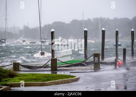 Stock photos of Tropical Storm Henri from 2021 hitting Newport, Rhode Island. View of sail boats and docks during a storm. Stock Photo