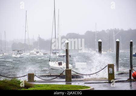 Stock photos of Tropical Storm Henri from 2021 hitting Newport, Rhode Island. View of sail boats and docks during a storm. Stock Photo