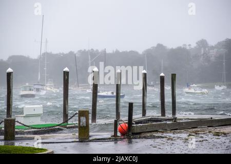 Stock photos of Tropical Storm Henri from 2021 hitting Newport, Rhode Island. View of sail boats and docks during a storm. Stock Photo