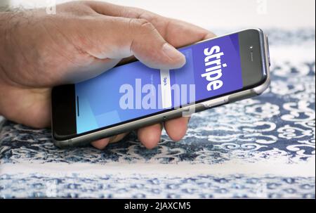 San Francisco, CA, USA, March 15, 2022: Stripe mobile application login page on the screen of a hand held smartphone. Stripe is an American financial Stock Photo